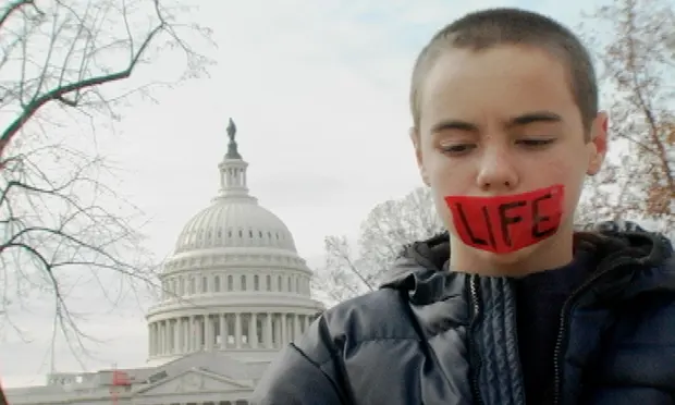 Levi O’Brien was 12 years old when he was featured in Jesus Camp. Camp activities included protesting abortion outside the supreme court. Photograph: Courtesy of Loki Films