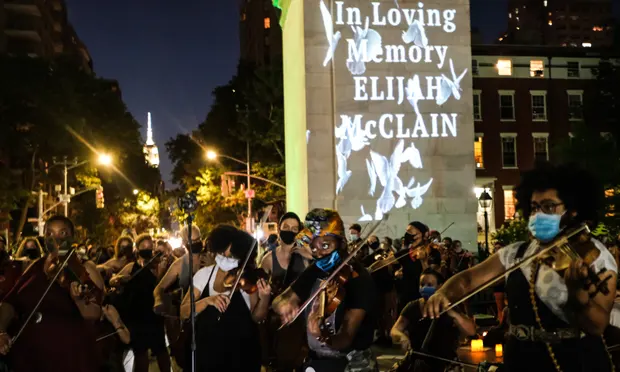 String players perform during a vigil for Elijah McClain in New York City. McClain played the violin. Photograph: Byron Smith/Getty Images