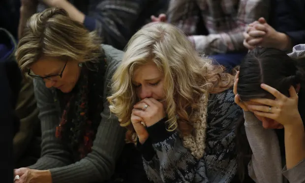 Women at vigil in Colorado Springs on Saturday for the victims of the Planned Parenthood clinic attack. Photograph: David Zalubowski/AP